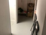 a room with a door and a shelf in it
