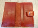 a close up of a wallet with a ring on it