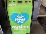 a green machine with a snowflake on the side of it