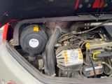 the engine compartment of a car with the hood open