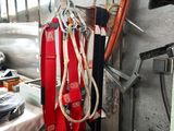 a firefighter ' s gear hanging on a wall in a room