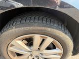 a close up of a tire on a car ' s rim