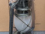 a lantern that is sitting on a table next to a box