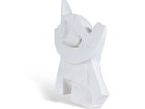 a white cat figurine sitting on a white surface