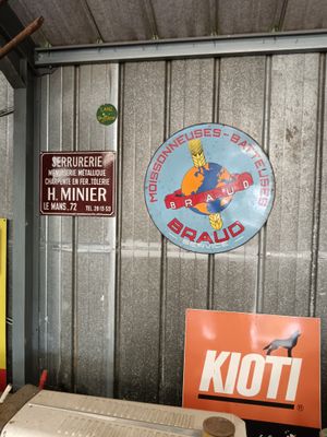 many different signs on the wall of a garage
