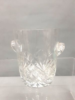 a glass vase that is sitting on a table