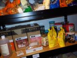 a shelf full of food and condiments on the shelves