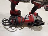 two electric tools that are sitting on a table