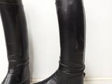 a pair of black boots that are next to each other