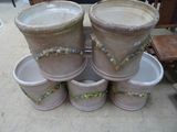 many pots that are stacked on top of each other