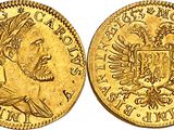 a gold sovereign coin with a crown on it