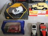 a lot of toy cars that are sitting on a table