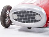 a toy car that is sitting on a white surface