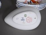 many plates and bowls that are sitting on a table