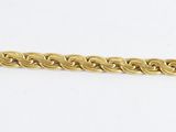 a close up of a gold chain on a white background