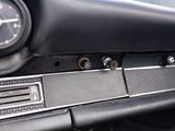a close up of a car dashboard with a clock on it
