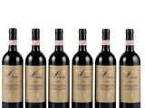 six bottles of red wine lined up in a row