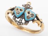 an image of a close up of a ring with two owls on it