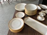 a lot of plates and cups on the table