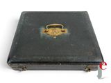 a black suitcase with a gold lock on it