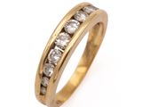 a close up of a gold ring with diamonds on a white background