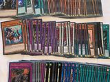 a close up of a bunch of cards on a bed