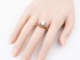 an image of a woman ' s hand with a diamond ring on it