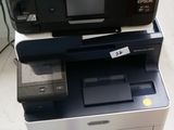 two printers sitting on top of each other on the floor