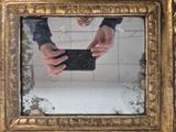 a person taking a picture of themselves in a mirror