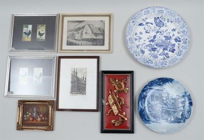 many plates and pictures on the wall of this room