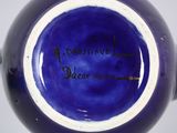a blue vase with writing on it that says a question dear mia