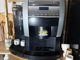 a coffee machine that is sitting on top of a shelf
