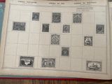 a book with stamps on it sitting on a table