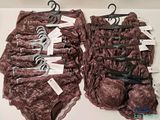 two bras and a pair of scissors on a table