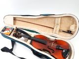 a violin in a case with a bow in it
