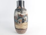 a vase with a painting of a farm scene on it