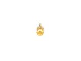 a gold charm with a small yellow stone on it