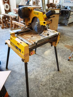 a table that has a saw on it in a room