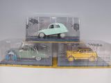 three toy cars in a display case on top of each other