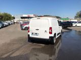 a white van that is parked in a parking lot