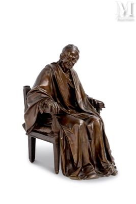 bronze statue of a man sitting on a bench with his feet crossed
