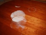 a wooden table with a white object on top of it