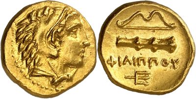 a gold coin with the head of a lion on it
