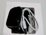 a black apple watch sitting in a white box