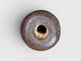 a small metal object with a hole in the middle of it