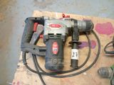 a picture of a drill and other tools on a piece of cardboard