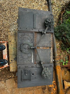 an old iron door on the side of a building