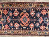 an old rug with a floral design on it