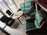 chairs and a table in a room with a glass door