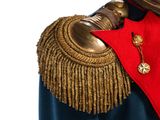an image of a man in a military uniform with a red cape